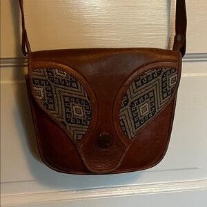 Vintage leather purse with embroidery detail. 2 interior compartments.